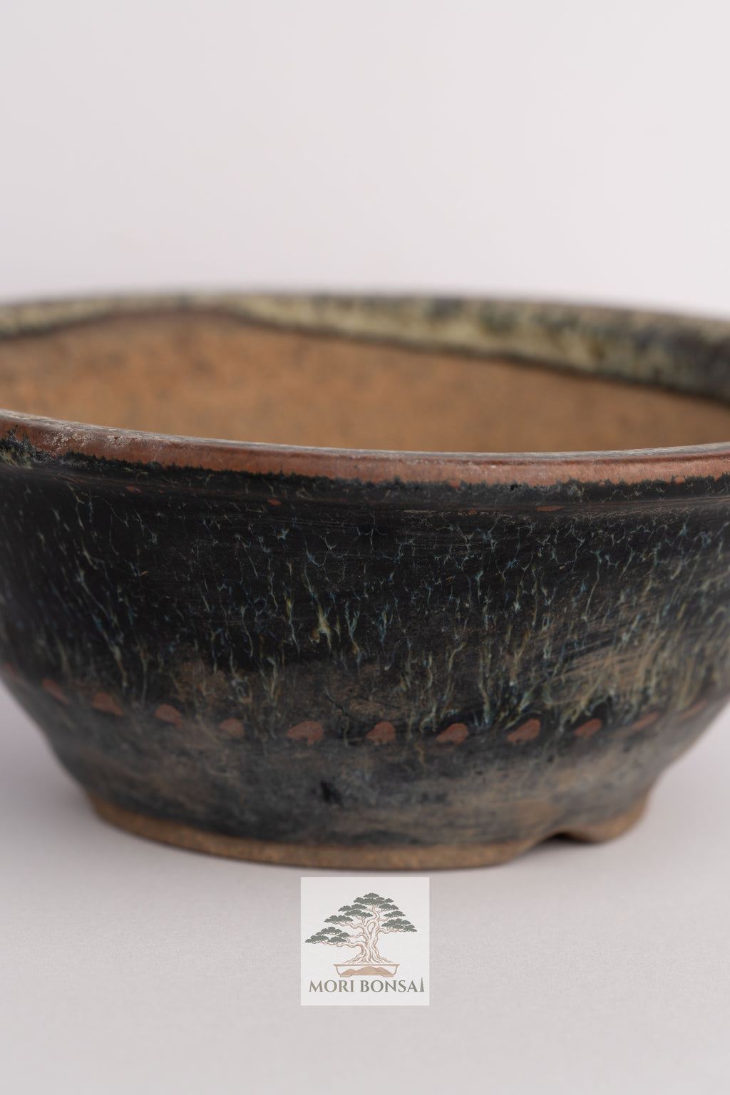 Aged Tokoname round bonsai pot POT-TOKO-001 front view with dark textured glaze