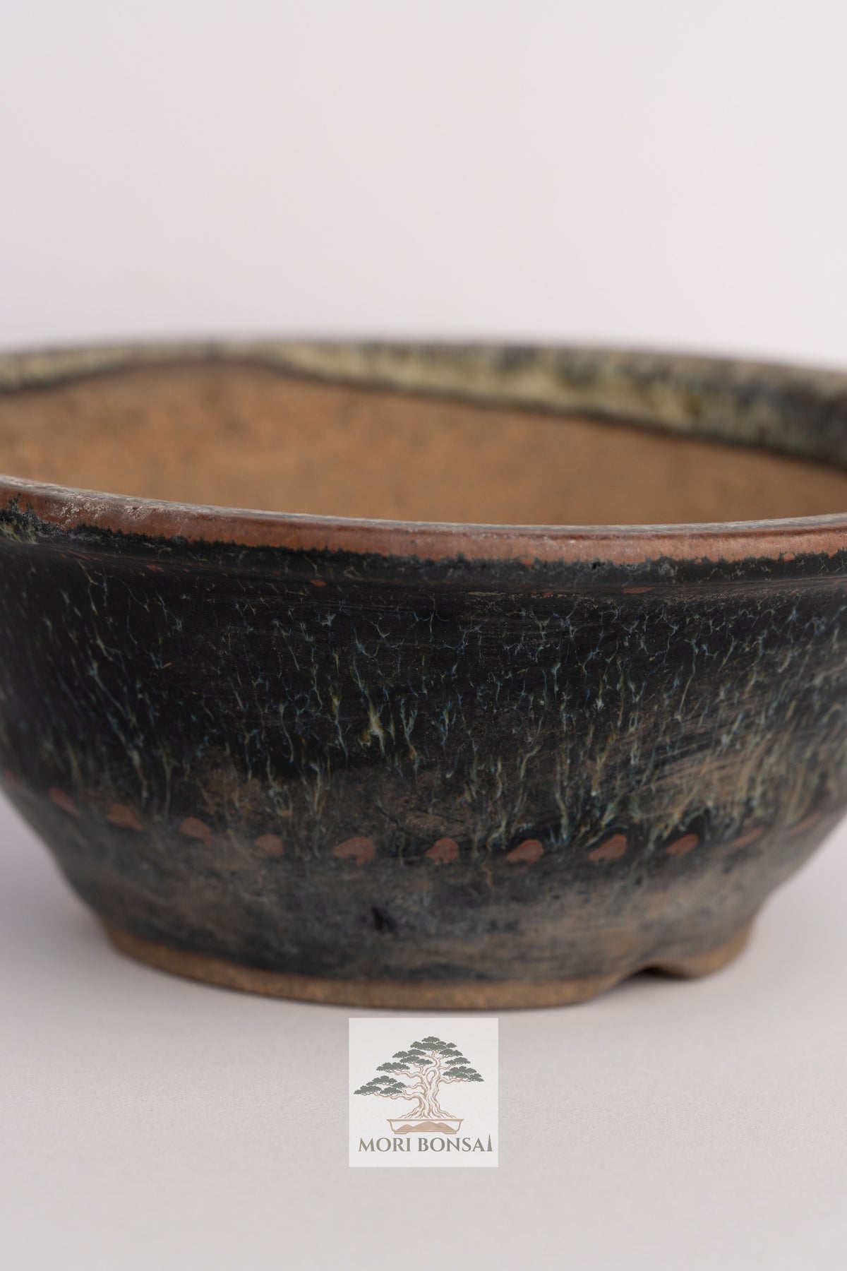 Aged Tokoname round bonsai pot POT-TOKO-001 front view with dark textured glaze