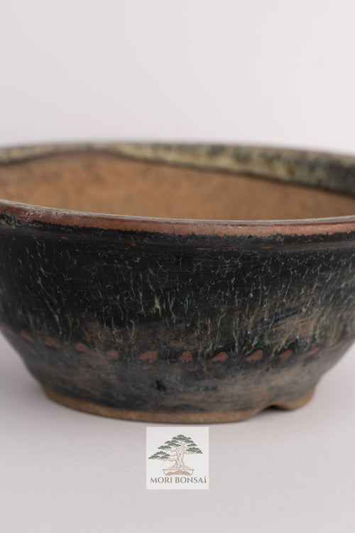 Aged Tokoname round bonsai pot POT-TOKO-001 front view with dark textured glaze